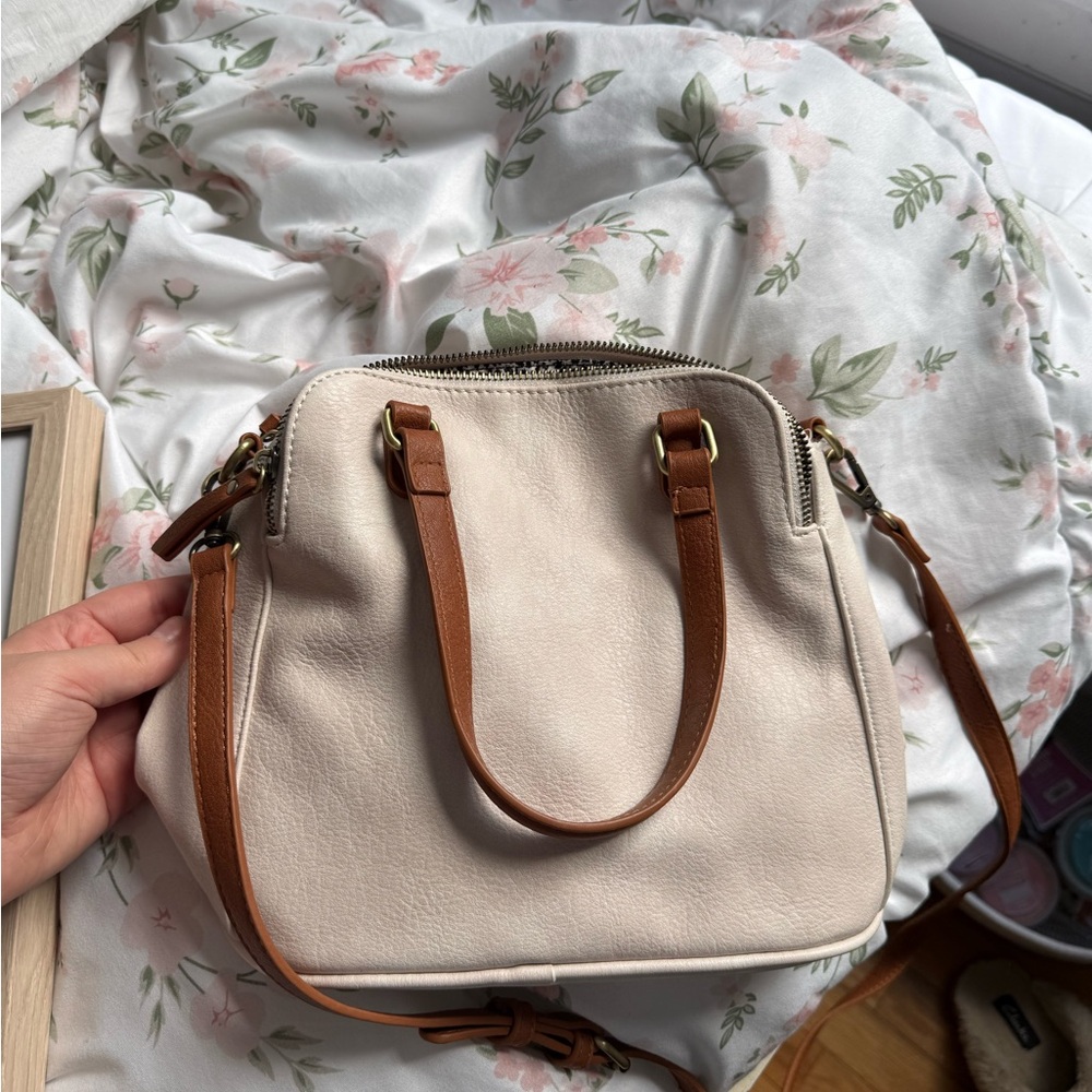 Cream leather purse with design inside